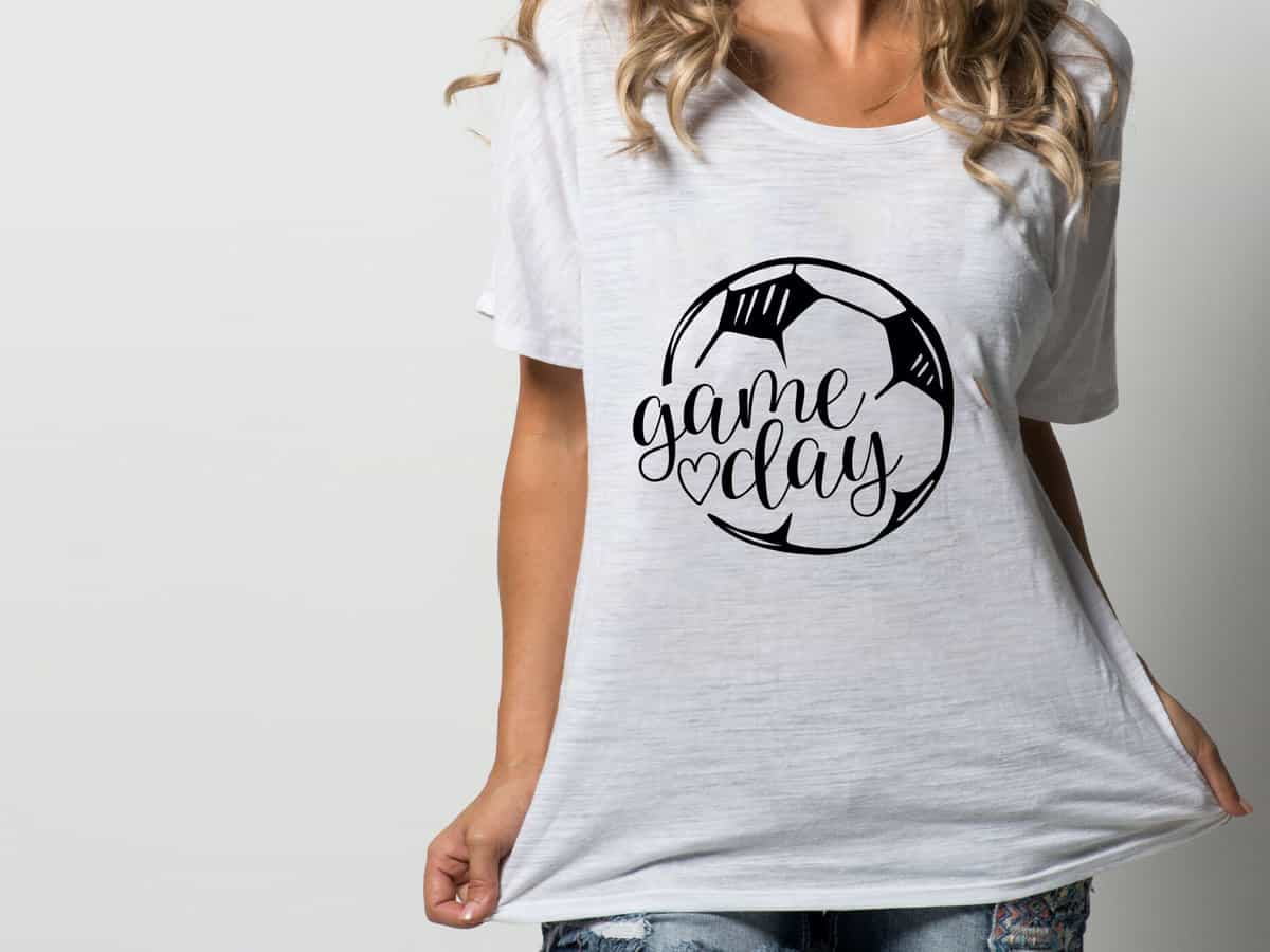 A T-shirt with a design that reads "game day" with a soccer ball.