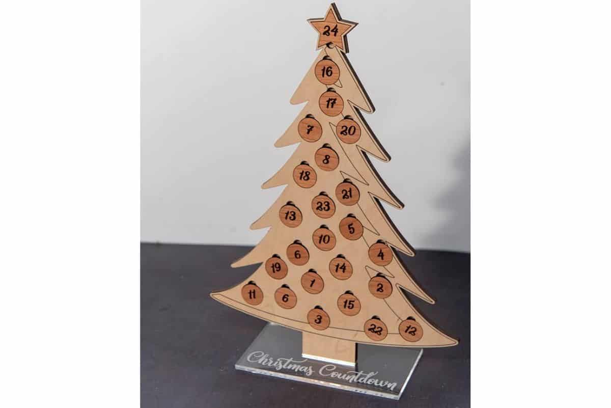 A Christmas countdown tree made from wood.
