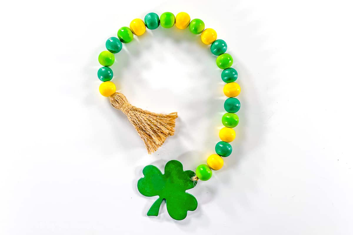 Green and yellow wood bead garland with a shamrock on the end.