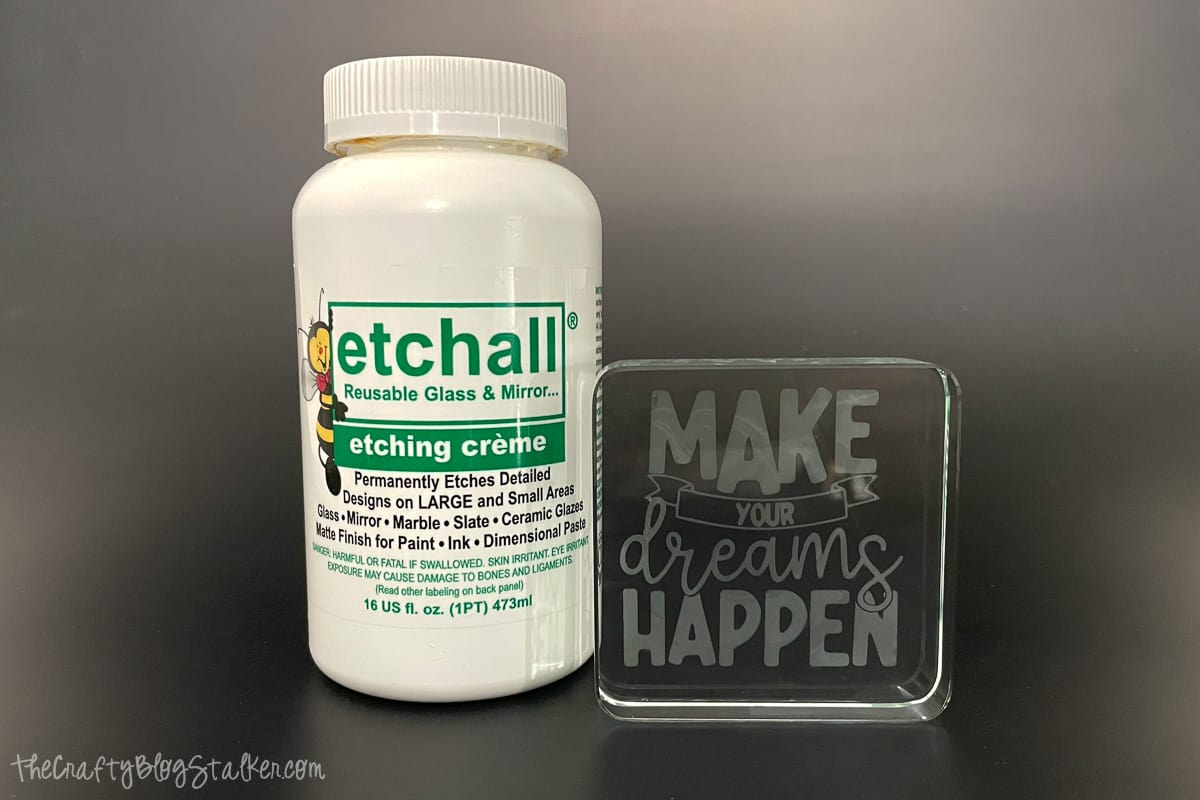 A jar of Etchall Etching Creme and a glass etched block with a black background.