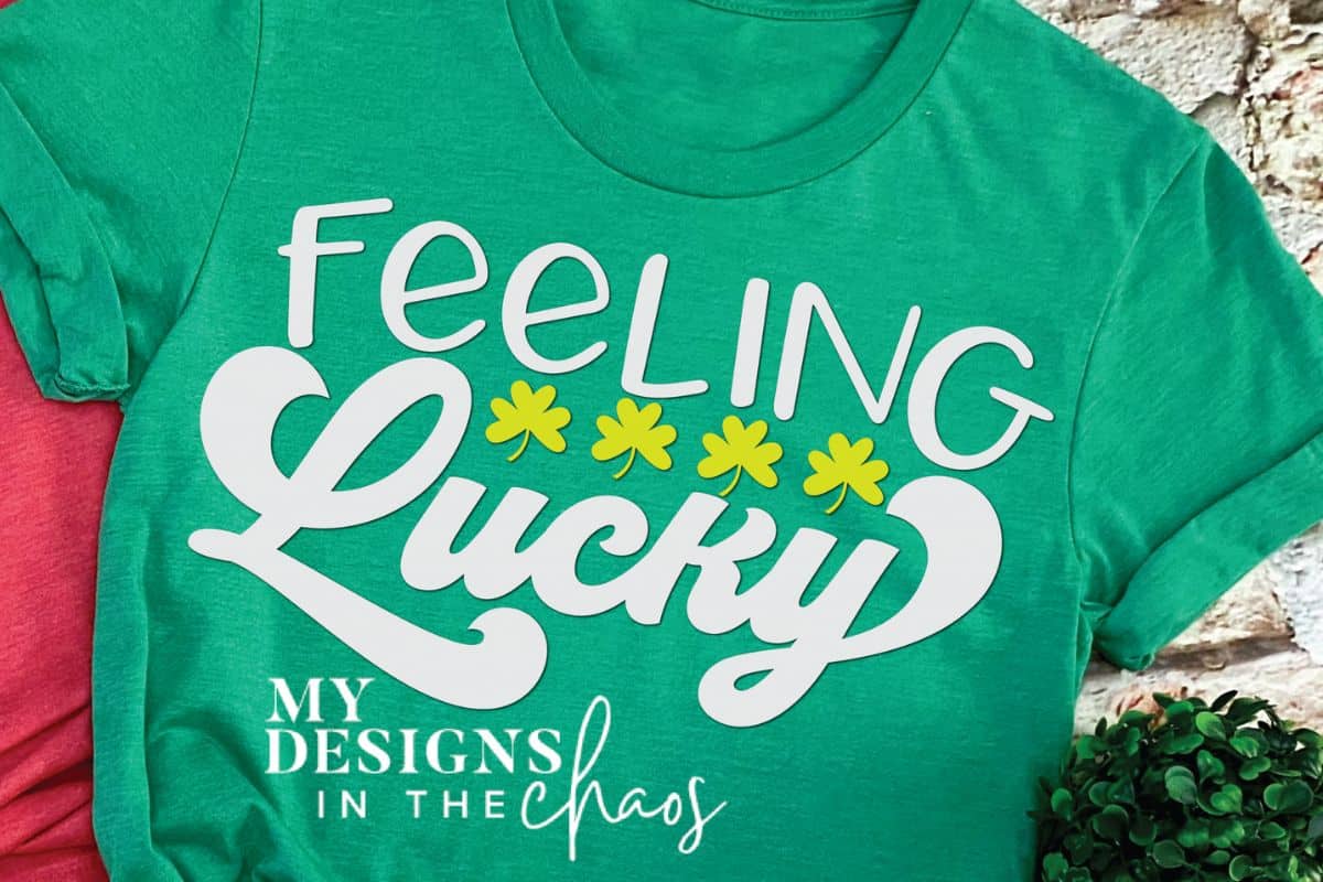 A green shirt with a design that reads feeling lucky.