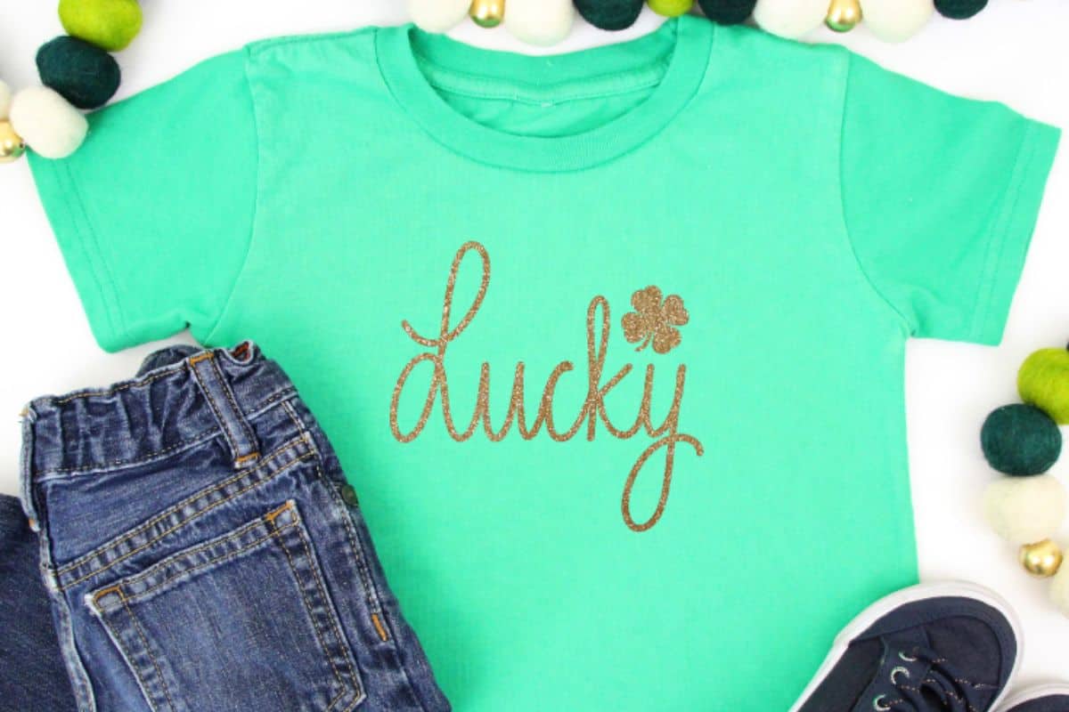 A green shirt with a design that reads  Lucky.