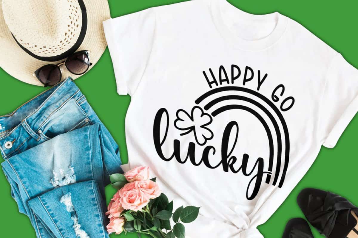 A white shirt with a design that reads Happy Go Lucky.