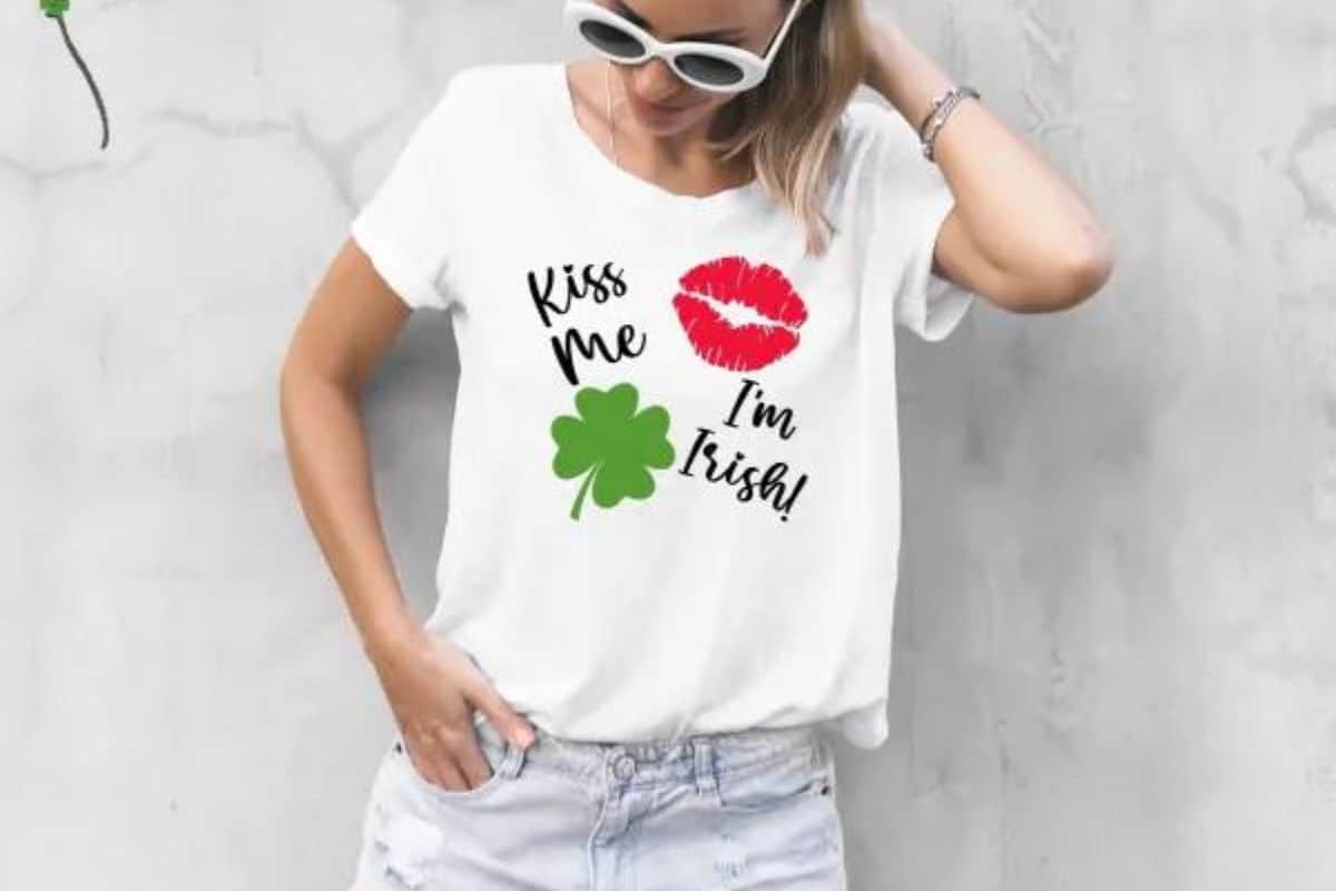 A white shirt with a design that reads kiss me im irish.