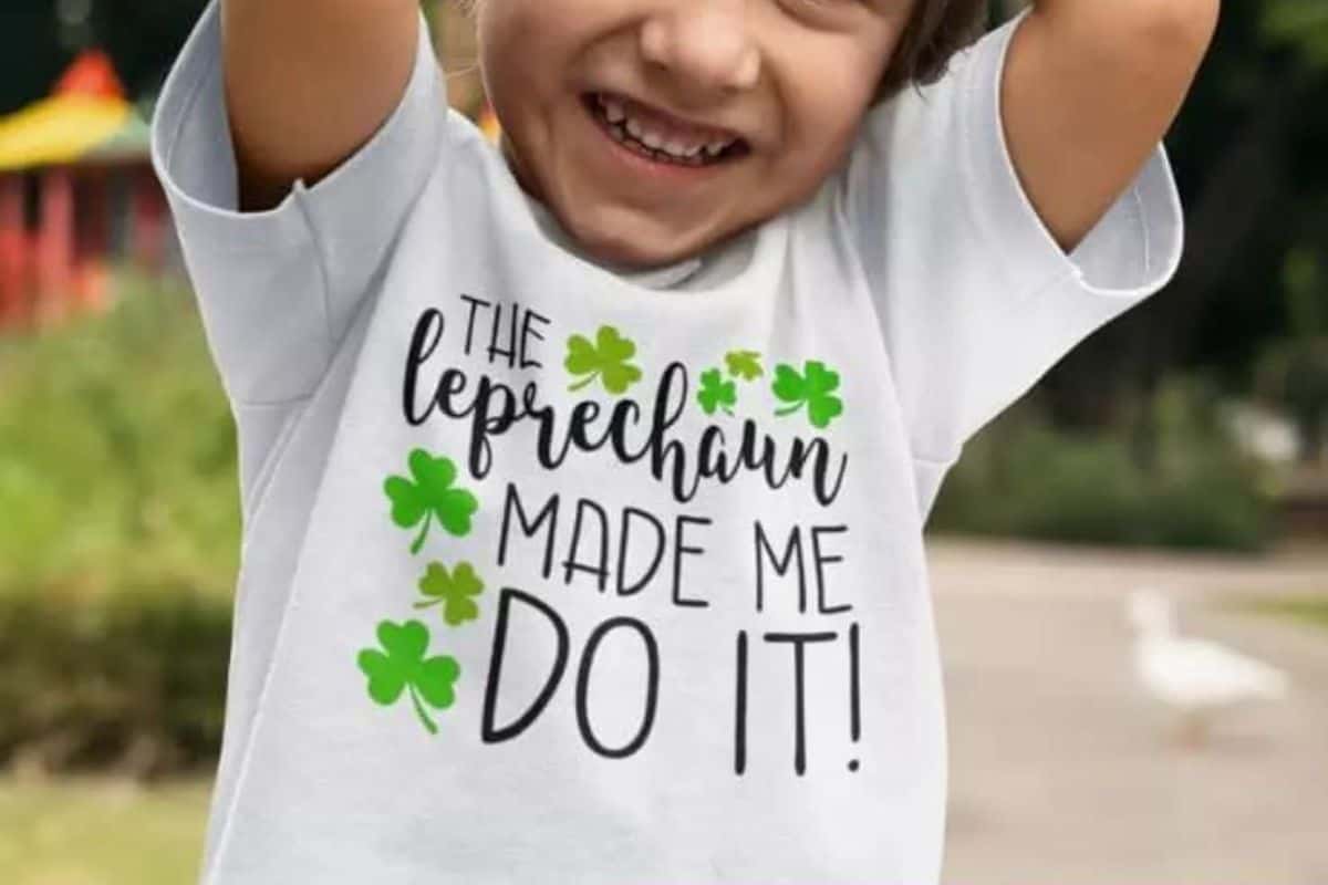 A white shirt with a design that reads the leprechaun made me do it.
