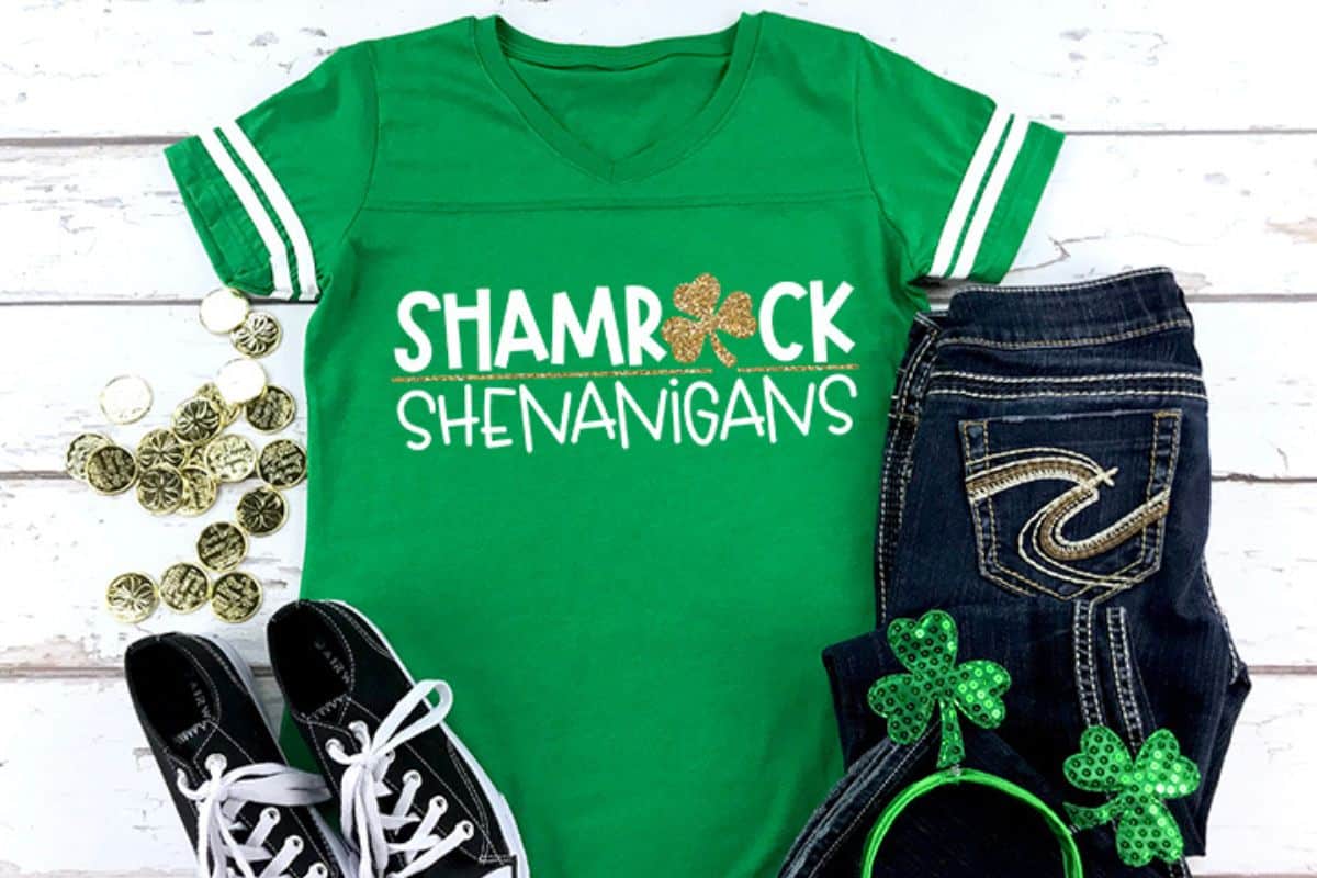 A green shirt with a design that reads shamrock shenanigans.