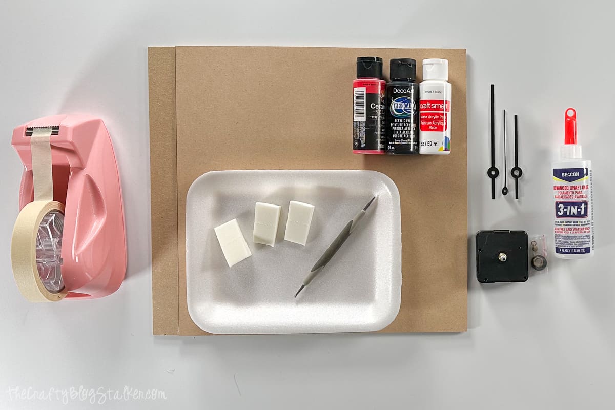 Supplies needed including, MDF sheets, clock pieces, paint, glue, masking tape, embossing tool, and makeup sponges.