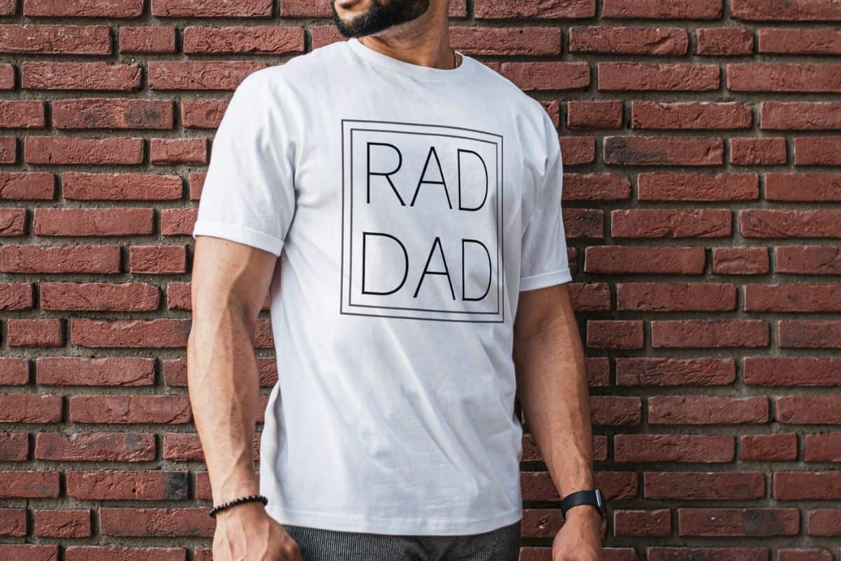 A man wearing a white t-shirt with a design that reads "Rad Dad".