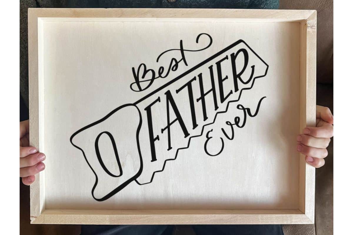 A wood tray with a design that reads "Best Father Ever".