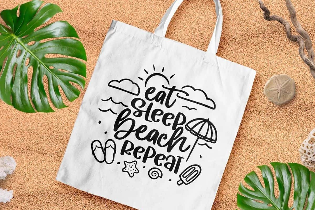 Eat Sleep Beach Repeat SVG cut file on a tote bag.