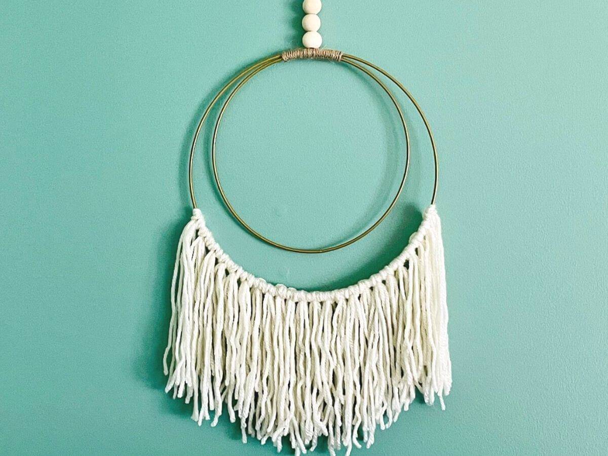 Easy DIY Boho Wall Hanging with gold rings.