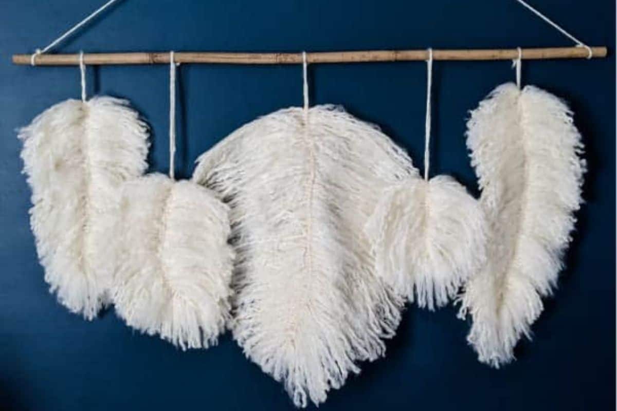 Fluffy Feather Wall Hanging made with white yarn.