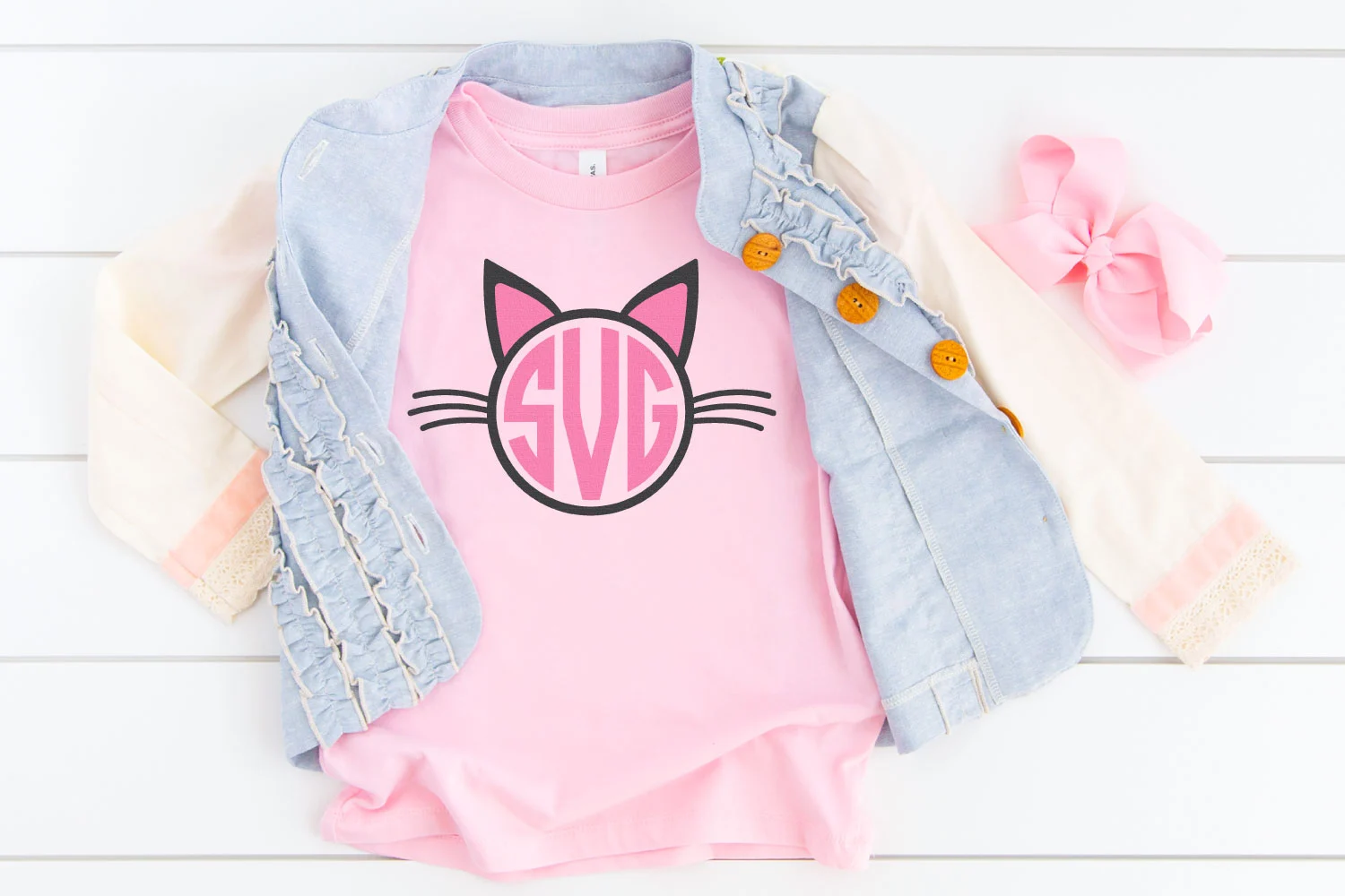 A pink t-shirt with a Cat Monogram design.