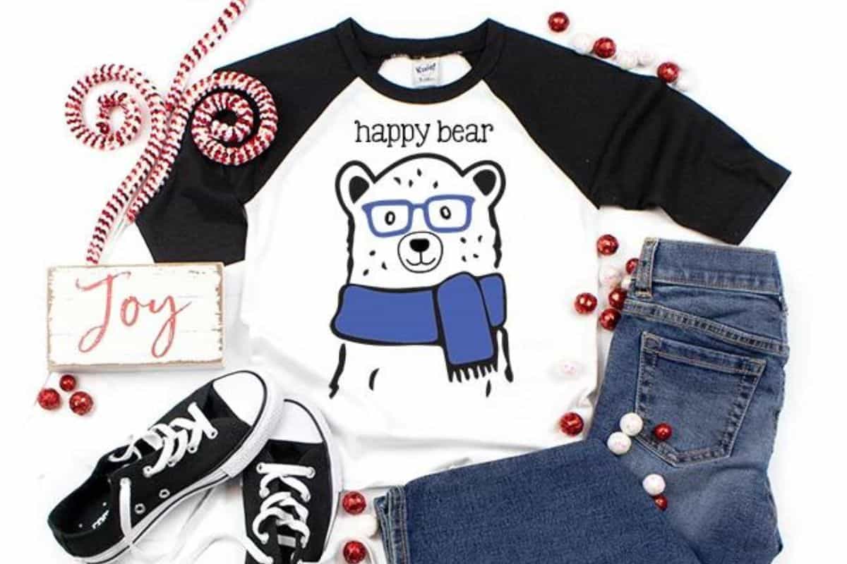 A vector file with a bear wearing a scarf and glasses and text that reads 'happy bear'.