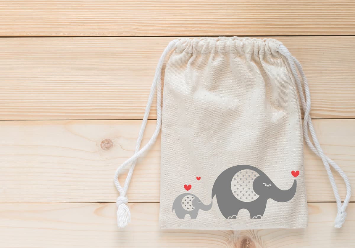 Elephant baby and mom vector image on a canvas bag.