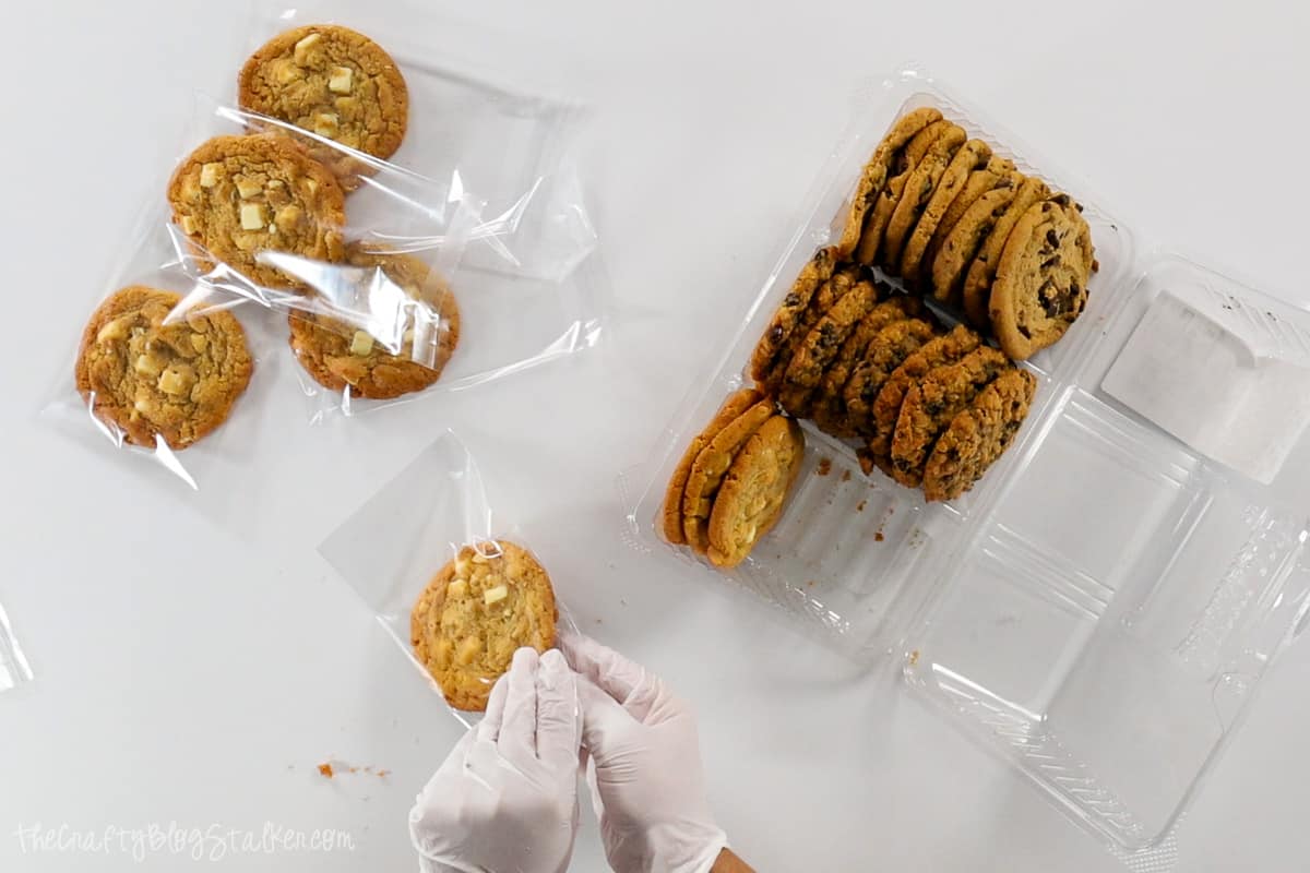 Packaging cookies into single serving bags.