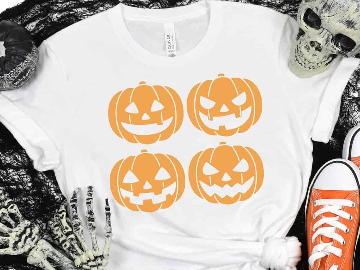 A t-shirt with 4 jack o'lanterns on it.