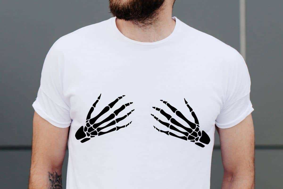 Man wearing a t-shirt with skeleton hands.