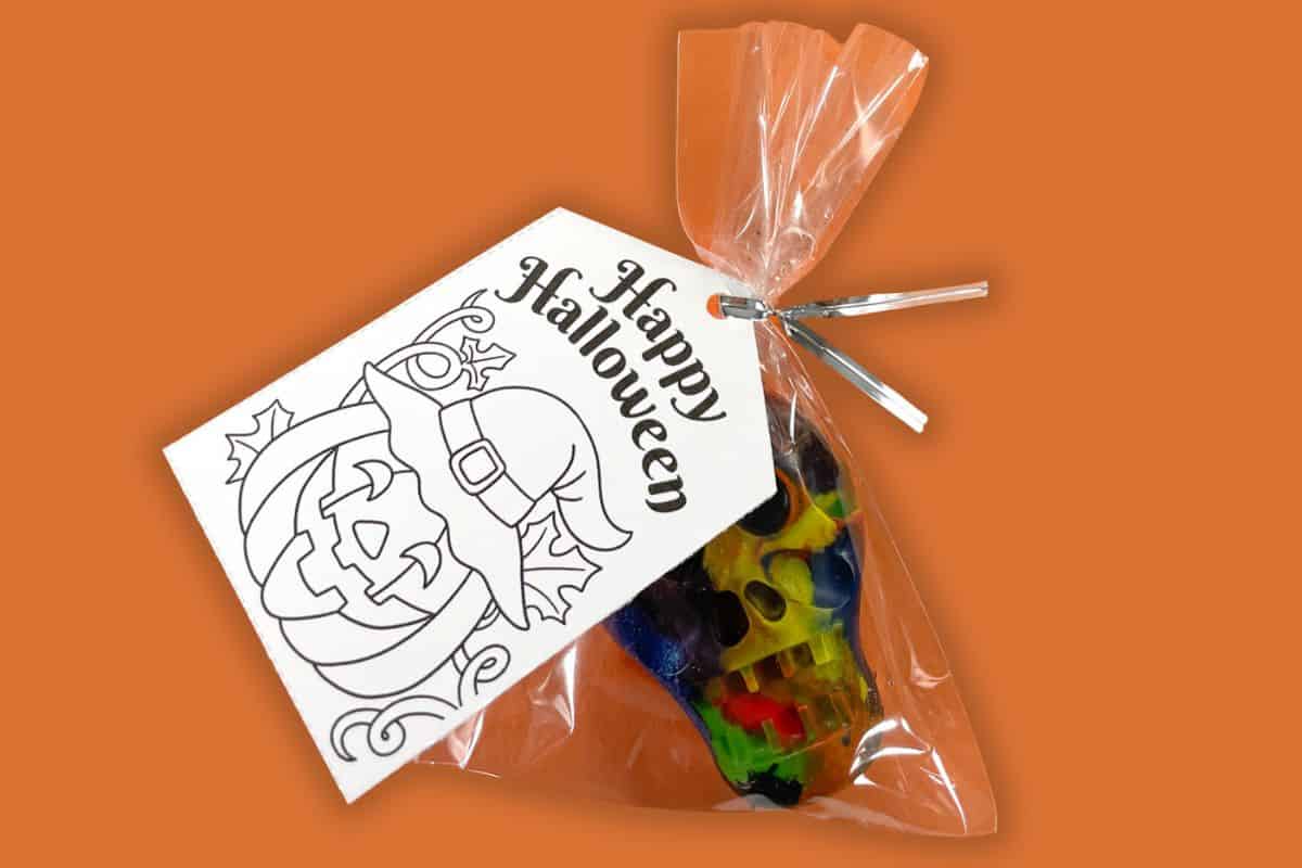 Shaped Halloween crayons with a printable tag.