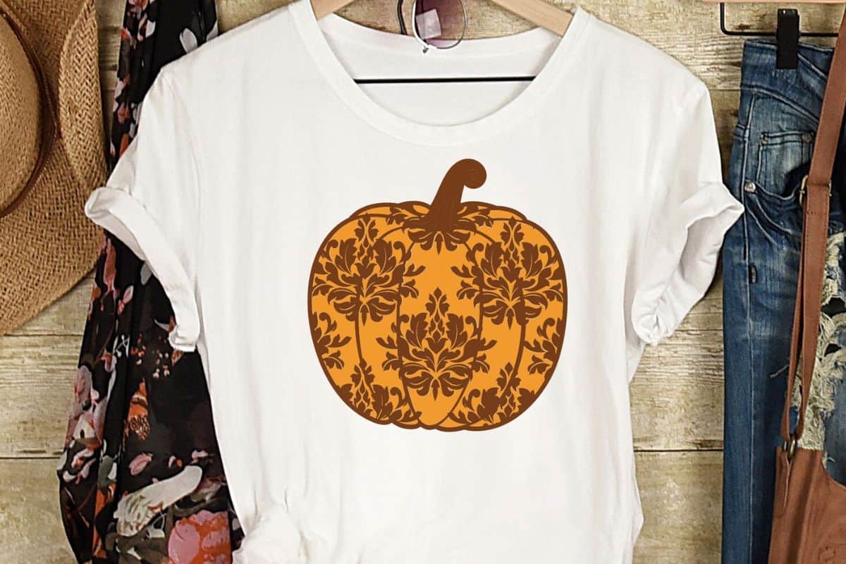 White shirt on a hanger with a layered damask pumpkin.