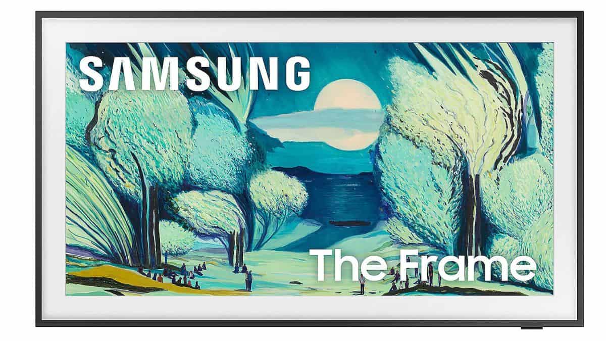 Samsung Frame TV displaying a colorful landscape painting of trees, a lake, and a moonlit sky with 