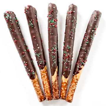 Five delicious chocolate covered pretzel rods.