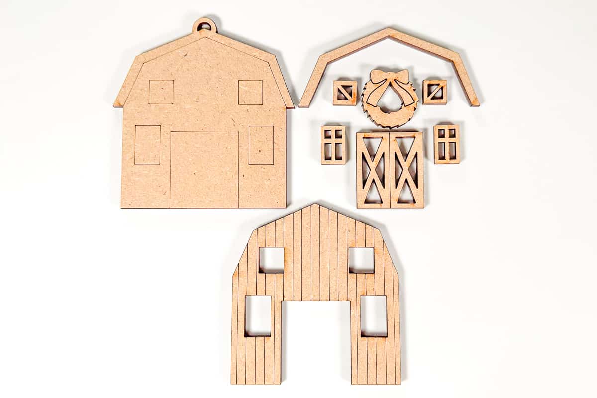 Cut pieces to make a barn Christmas ornament.