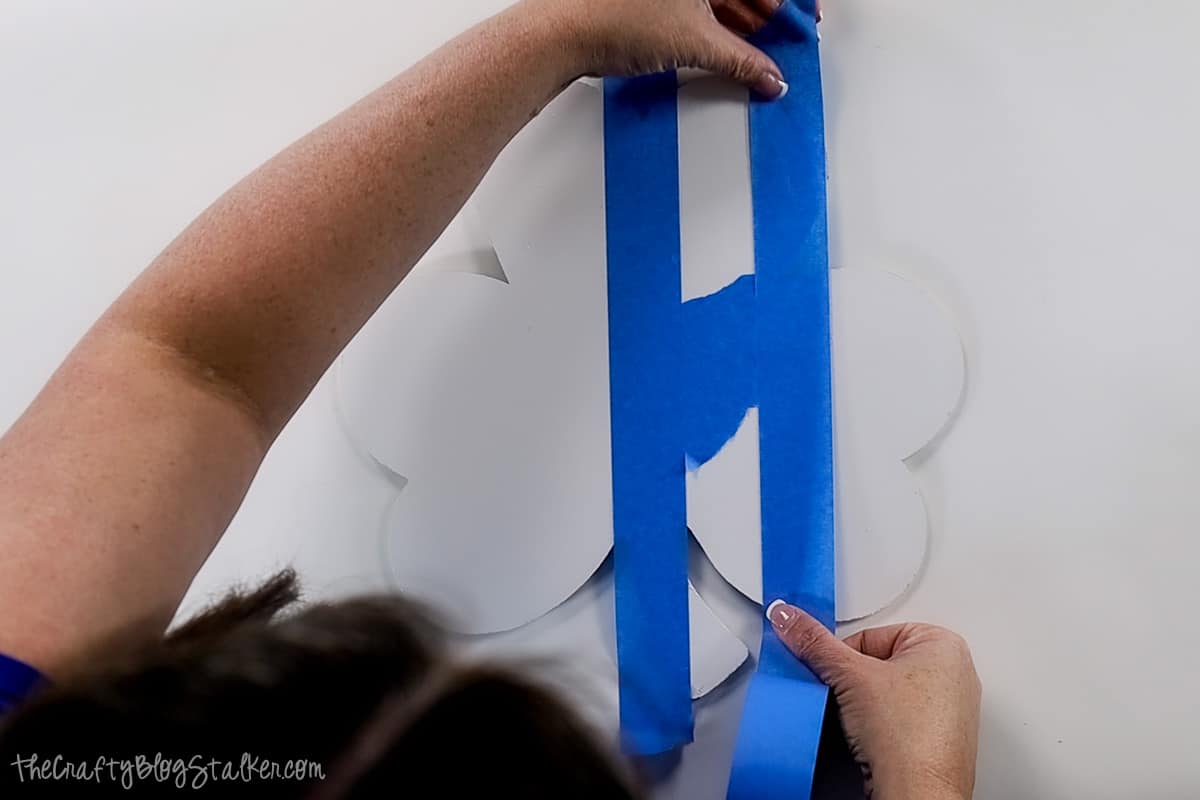 Adding a second strip of painter's tape to create  evenly spaced stripes