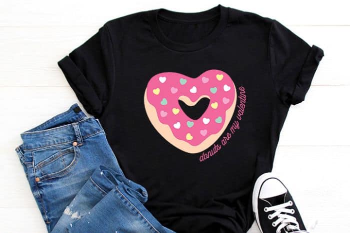 Black t-shirt with a heart shaped donut.