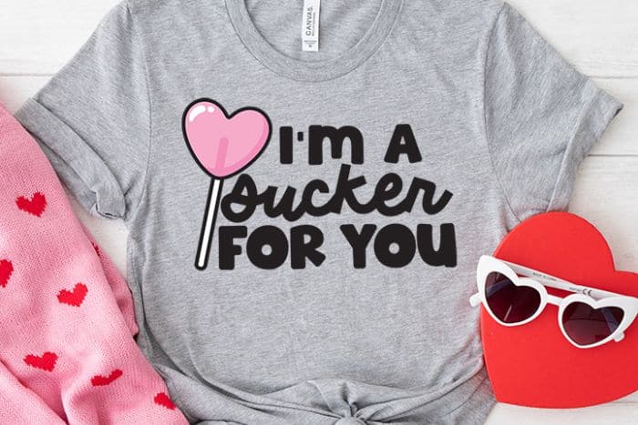Grey t-shirt with a design that reads 'I'm a Sucker for You'.
