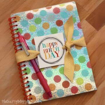 Birthday gift of a notebook, pen, and printable gift tag.