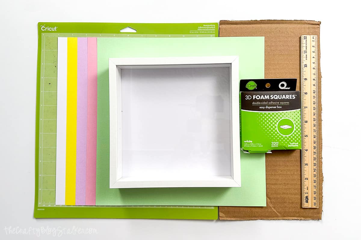 Shadowbox frame, pastel cardstock, cardboard, foam squares, and a StandardGrip mat.