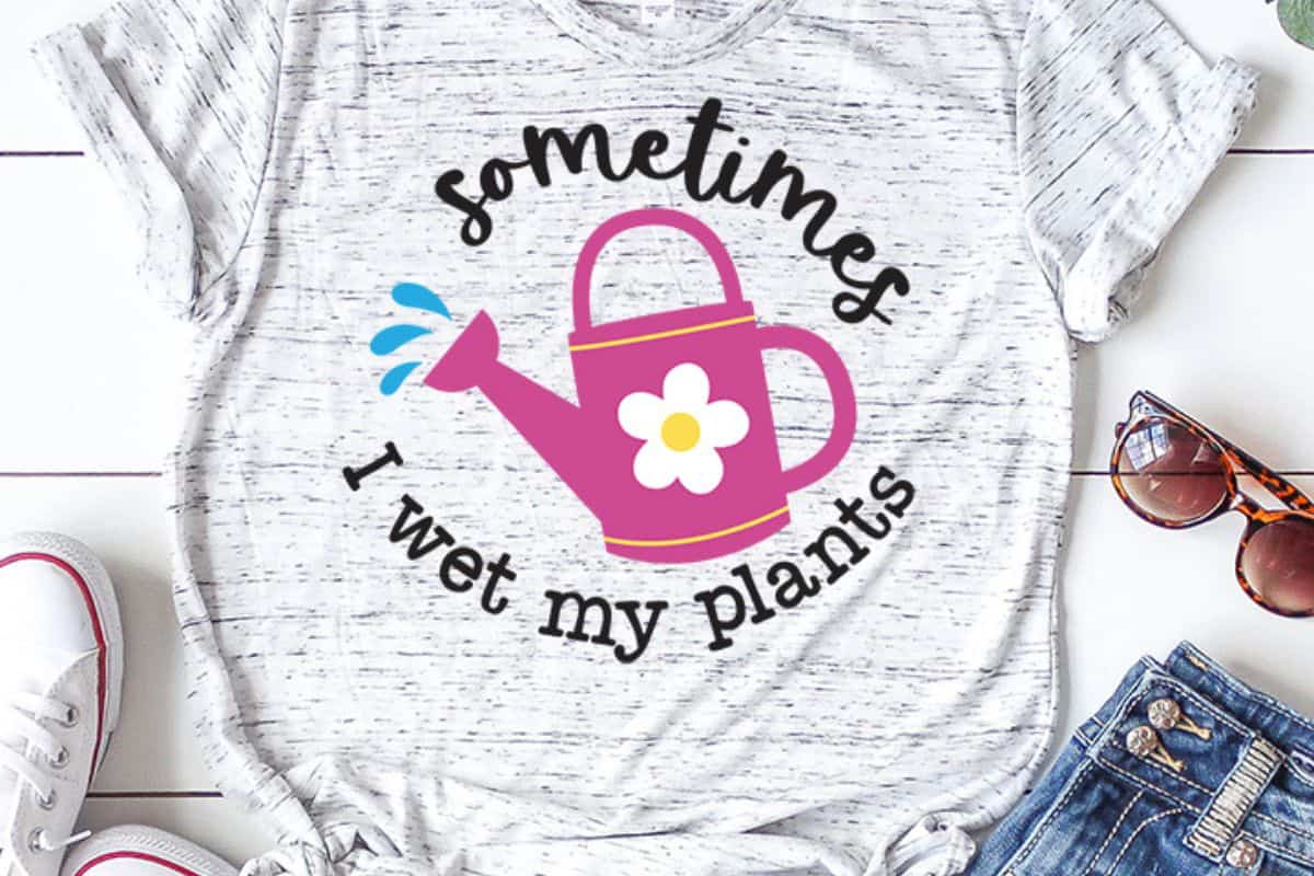 SVG design on a t-shirt with a watering can and text that reads 'sometimes I wet my plants'.