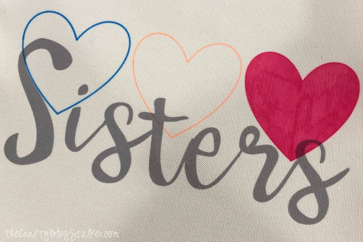 Sisters tote bags made with Cricut Infusible Ink.