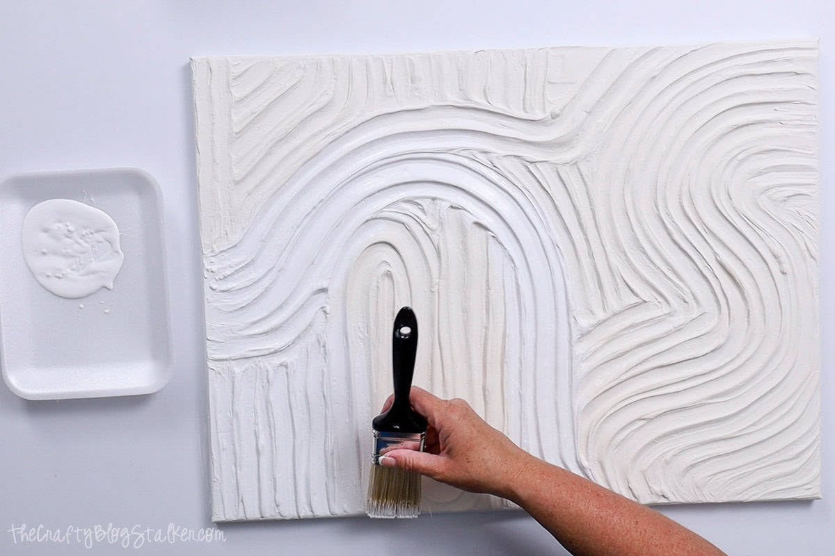 Painting texture art with white acrylic paint.