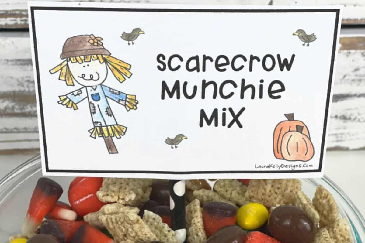 Scarecrow munchie mix gift tag in a bowl of snack mix.