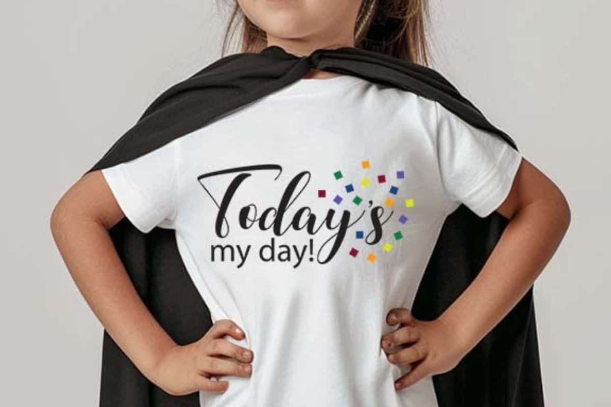 Girl wearing a white t-shirt with the design "Today's My Day" with confetti.