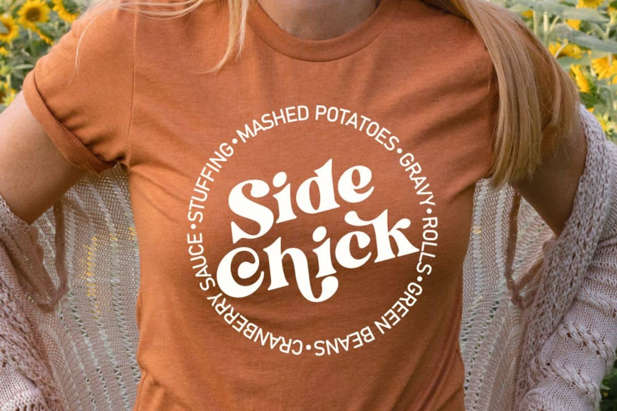 Woman wearing a burnt orange shirt with the design - I'm A Side Chick.