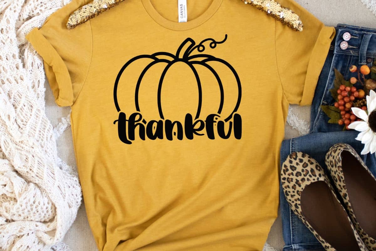 Yellow shirt with a thankful pumpkin design.