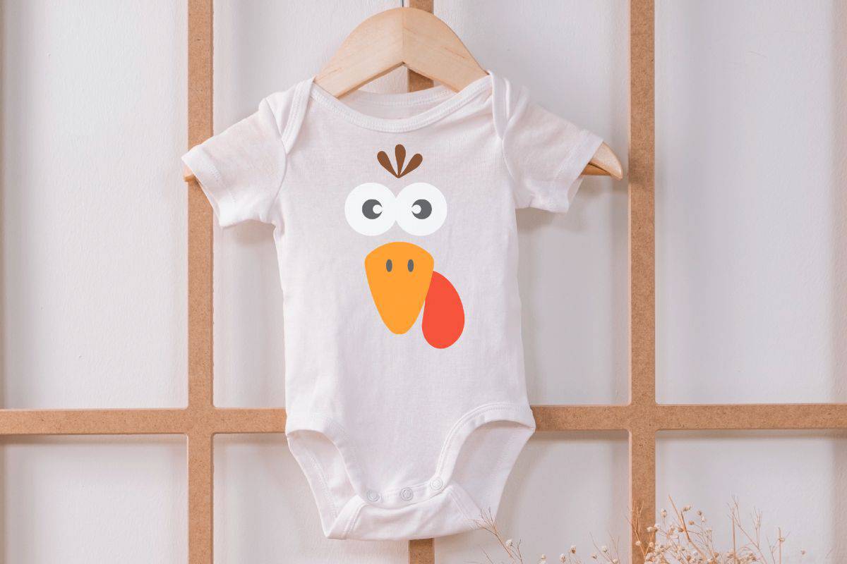 Baby shirt with a turkey face design.