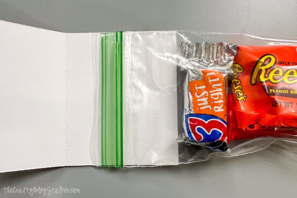 Adhering the bag of candy to the printed tag.