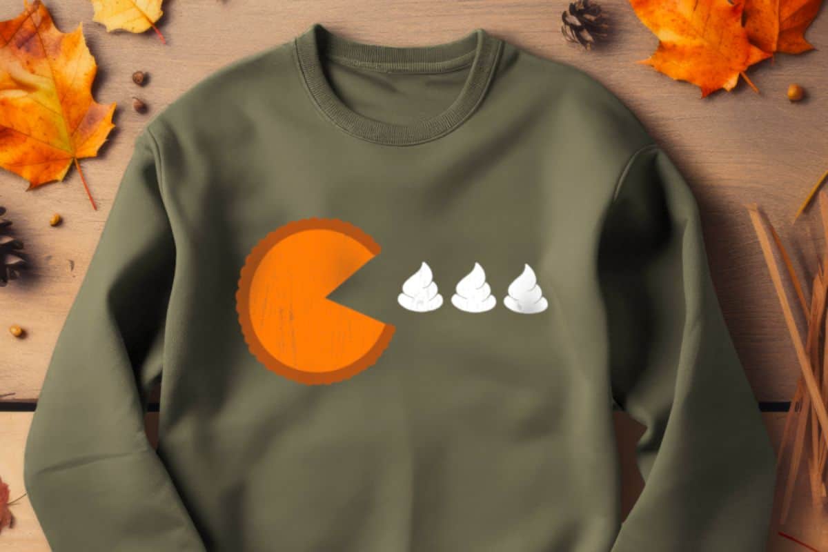 Forest Green sweatshirt with a pie and whipped topping design that looks like pac-man.