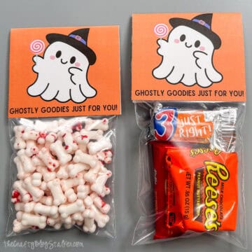 Two bags of candy with a printable halloween bag topper.