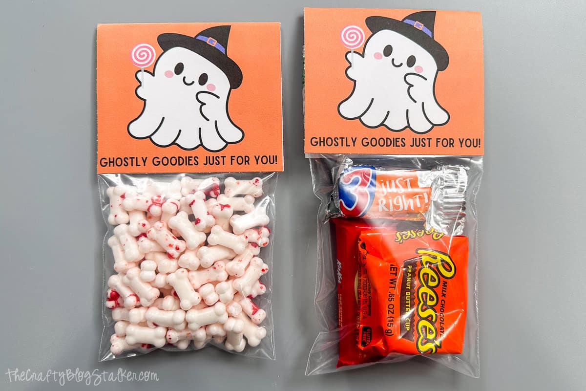 Two bags of candy with a printable halloween bag topper.