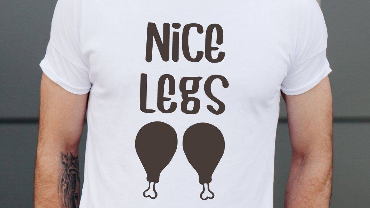 Person wearing a white T-shirt with the words 