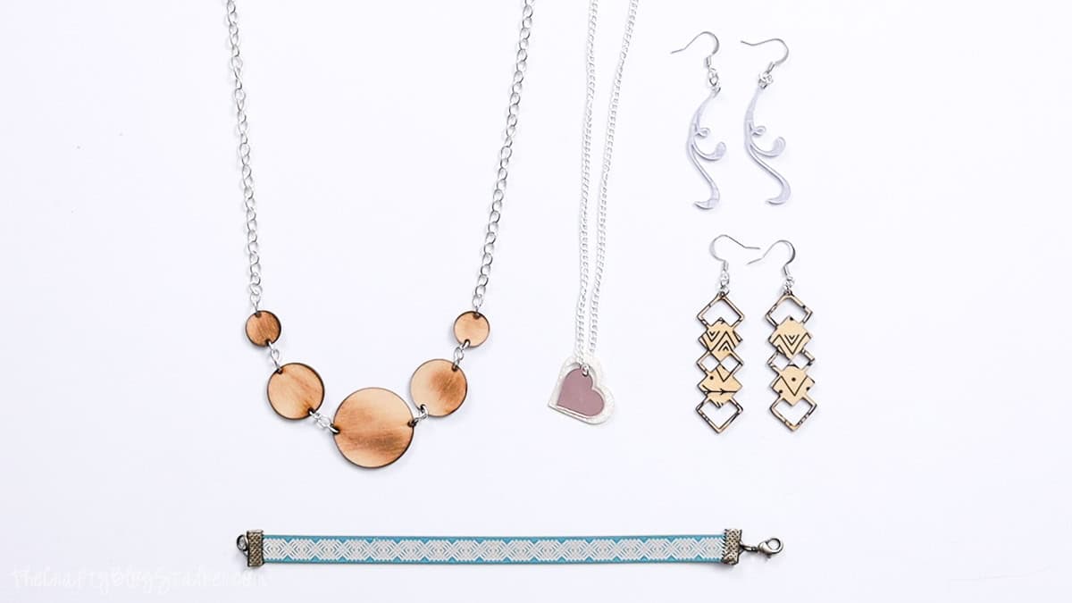 Five pieces of jewelry made with Craft Closet materials and a laser cutter.