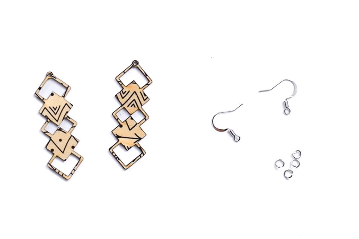 Two laser cut wood pieces, two earring hooks and four jump rings.