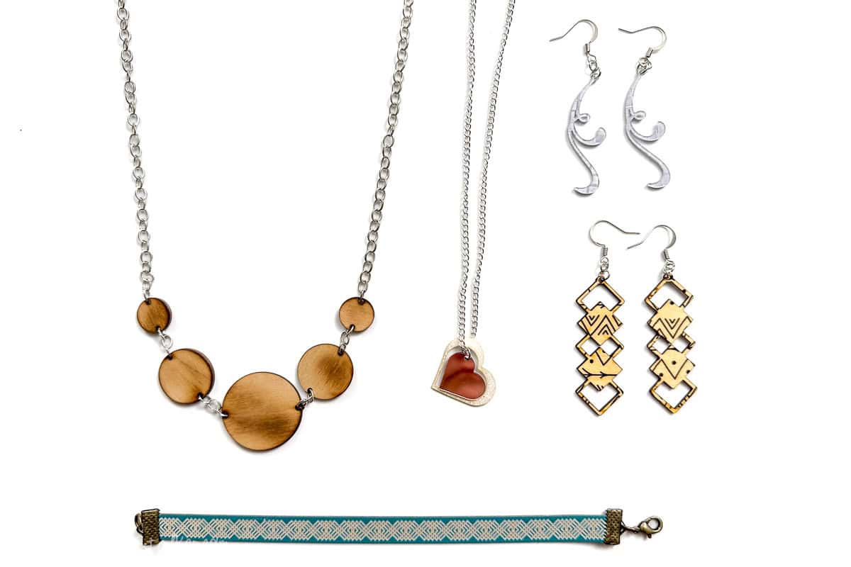 Five pieces of jewelry made with Craft Closet materials and a laser cutter.