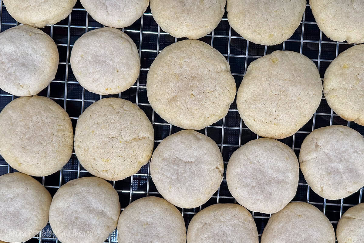 Lemon cookies resting on a cooling rack.