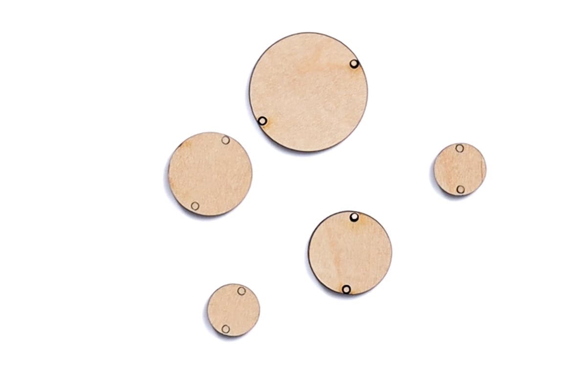 Wood circles cut with a laser to make a necklace.